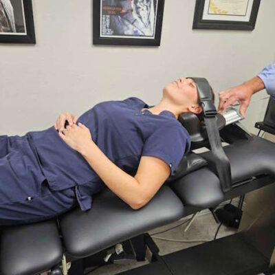 Patient undergoing cervical spinal decompression for neck pain and pinched nerve relief in Edmond.